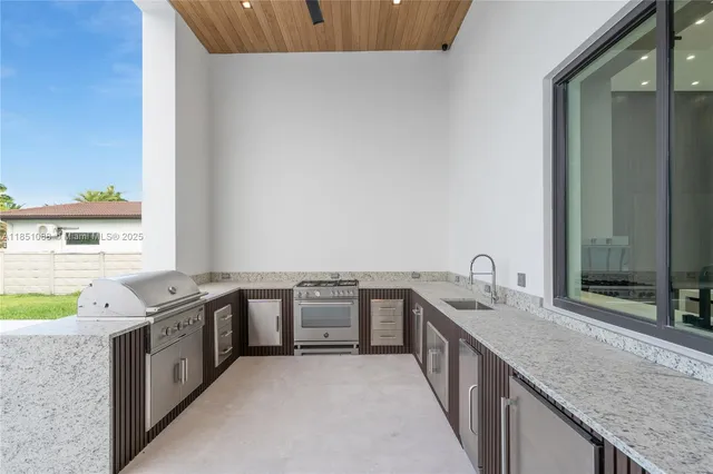 an aerial view of residential houses with outdoor space and river