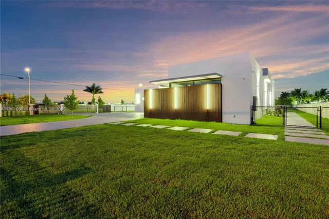 a view of an empty room with a floor to ceiling window and stairs
