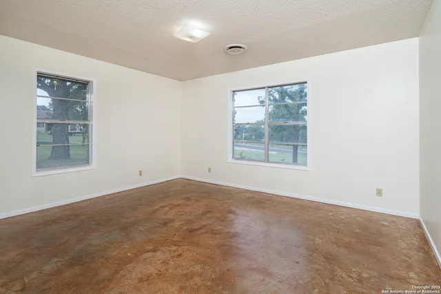 an empty room with windows