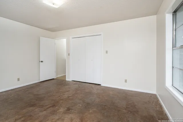 an empty room with windows