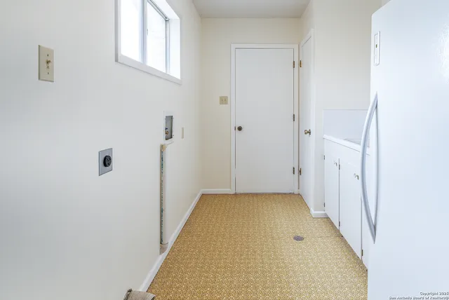 a view of a hallway with a white walls