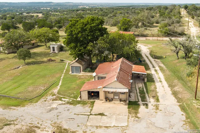 an aerial view of residential houses with outdoor space