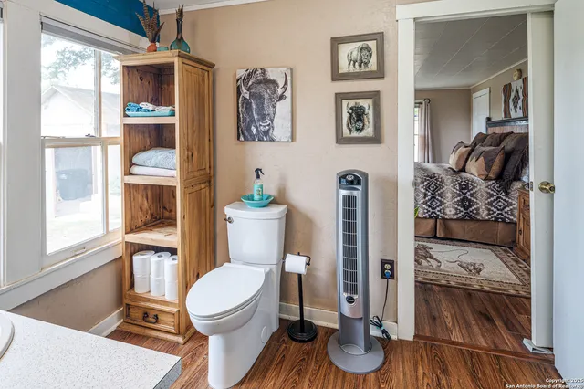 a bathroom with a tub and shower curtain