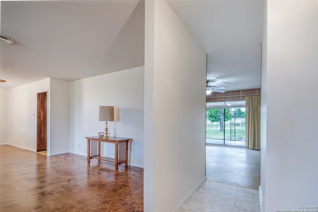 a view of a livingroom with furniture and an entryway