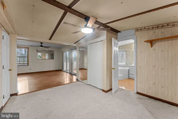 a kitchen with stainless steel appliances granite countertop a refrigerator a stove and a sink with wooden floor