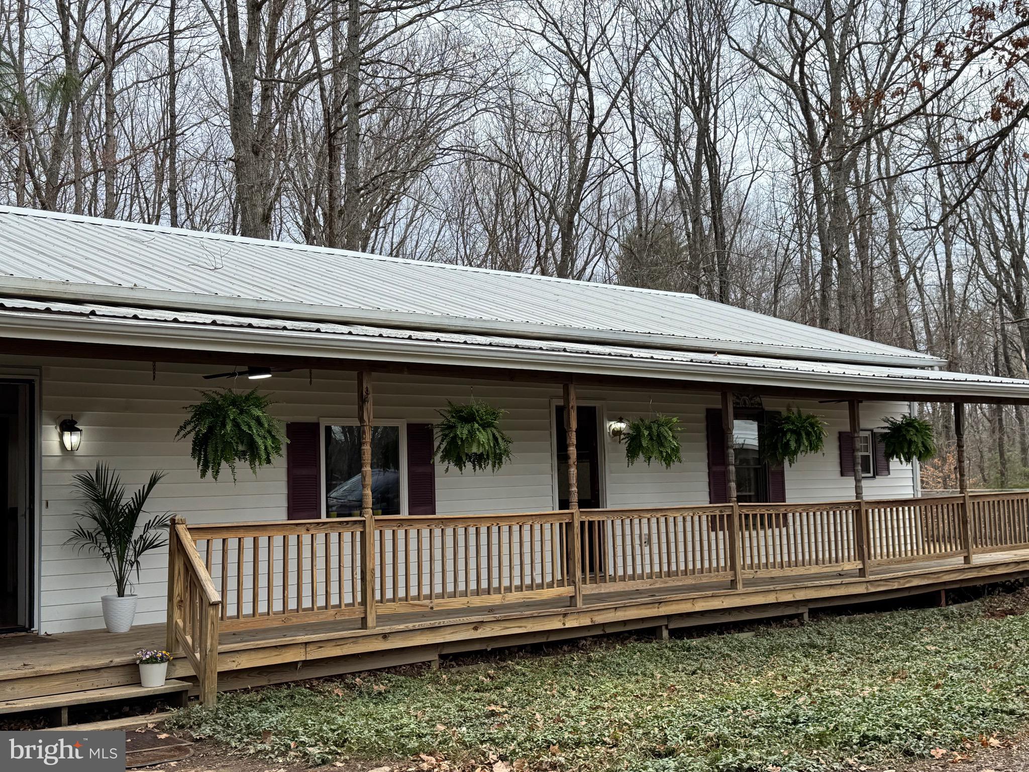29082 Raccoon Ford Road Burr Hill, VA 22433 - Photo 10 of 78 a view of a house with a small deck