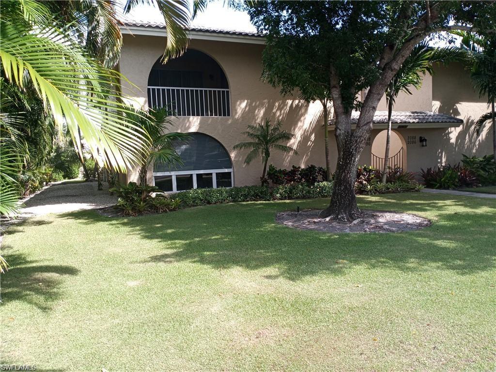 2096 Alamanda Drive, Unit 102 Naples, FL 34102 - Photo 11 of 23 a house view with swimming pool