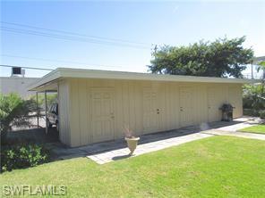 2096 Alamanda Drive, Unit 102 Naples, FL 34102 - Photo 18 of 23 a backyard of a house