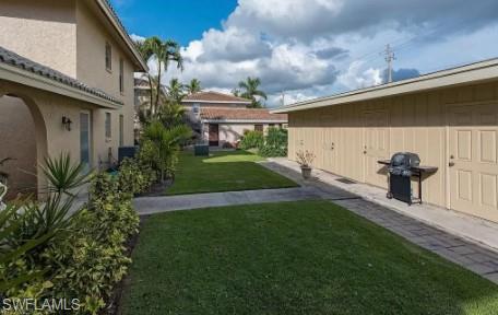 2096 Alamanda Drive, Unit 102 Naples, FL 34102 - Photo 22 of 23 a view of a back yard of the house