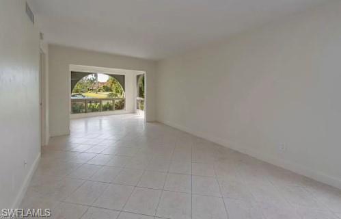 2096 Alamanda Drive, Unit 102 Naples, FL 34102 - Photo 3 of 23 a view of an empty room and window