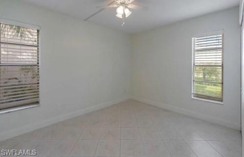 2096 Alamanda Drive, Unit 102 Naples, FL 34102 - Photo 5 of 23 an empty room with a window