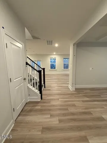 a view of a hallway with a room