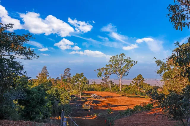 an aerial view of a house with a yard basket ball court and outdoor seating