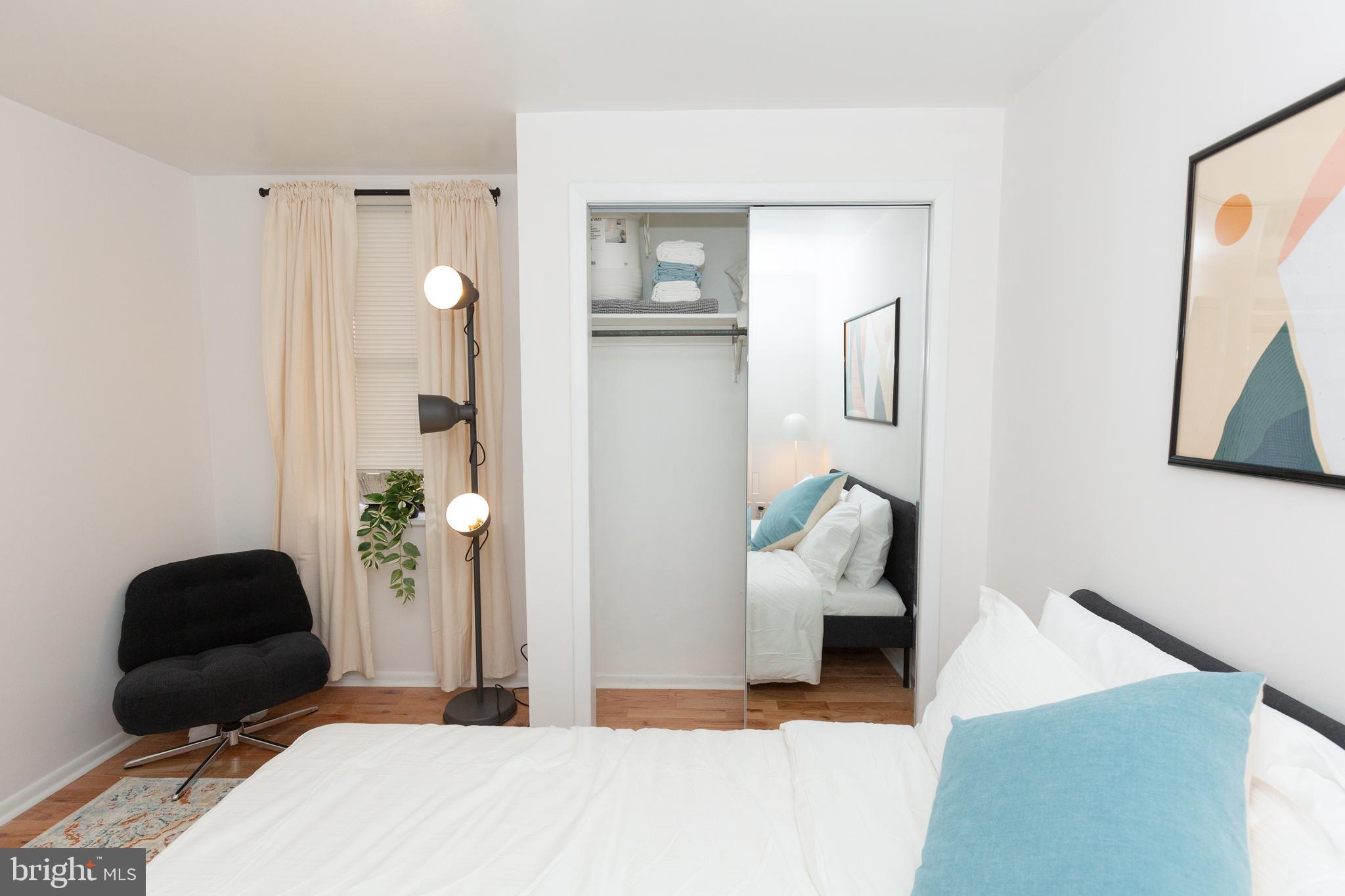 1915 Pemberton Street, Unit 2 Philadelphia, PA 19146 - Photo 15 of 16 a bedroom with bed and window