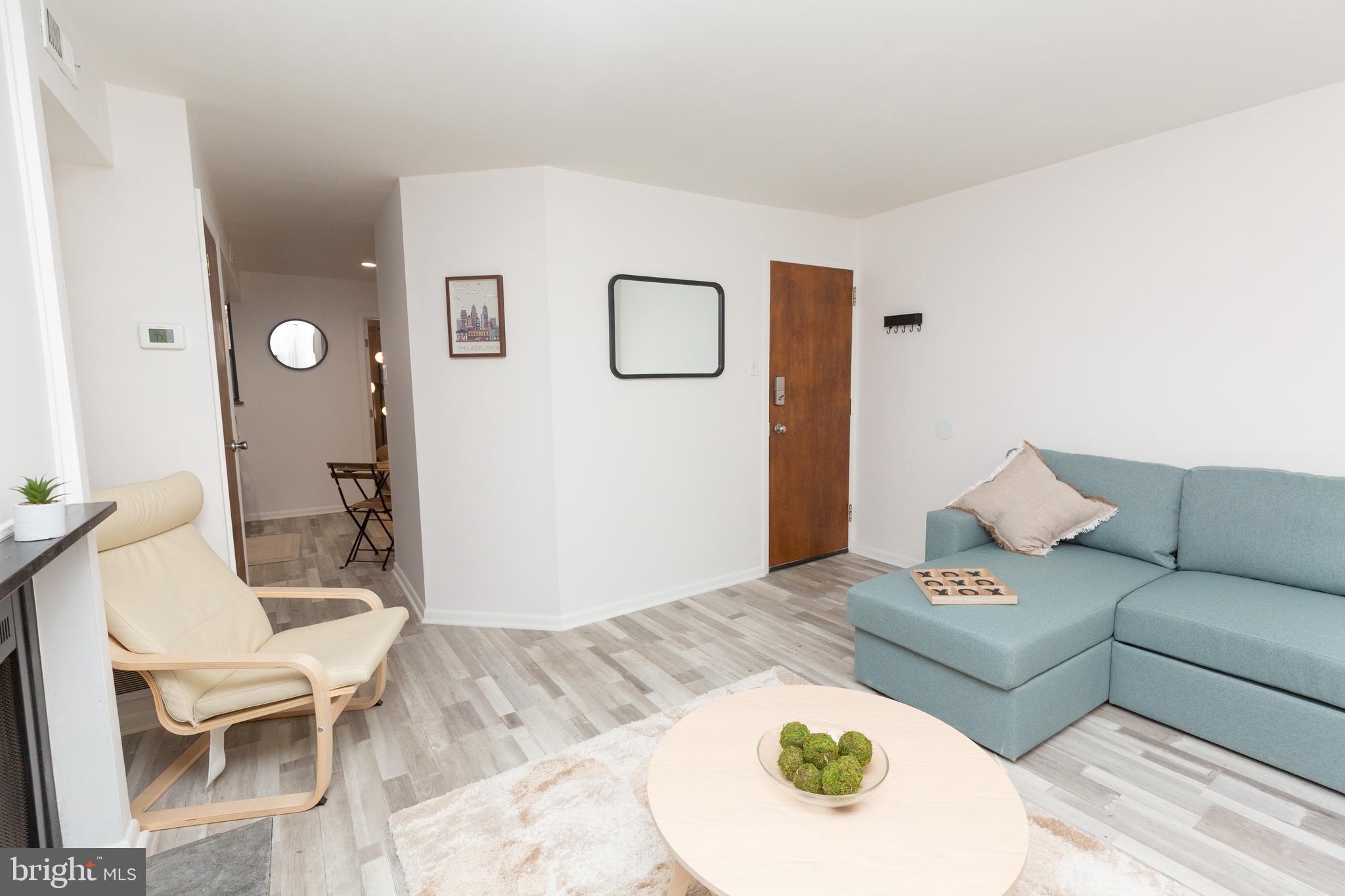 1915 Pemberton Street, Unit 2 Philadelphia, PA 19146 - Photo 4 of 16 a living room with furniture and a table