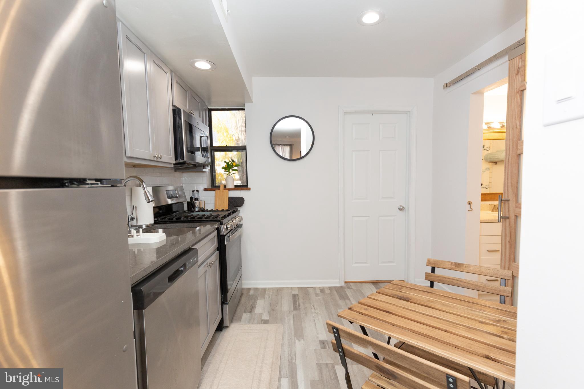 1915 Pemberton Street, Unit 2 Philadelphia, PA 19146 - Photo 6 of 16 a kitchen with a sink appliances and cabinets