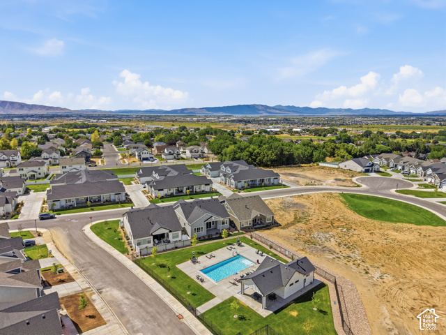 538 North Legend Circle, Unit 505 Mapleton, UT 84664 - Photo 6 of 48 Community pool with a dedicated pool house, surrounded by residential properties and open spaces