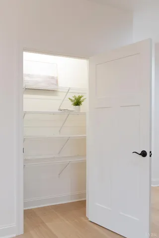 a kitchen with a refrigerator and a stove top oven