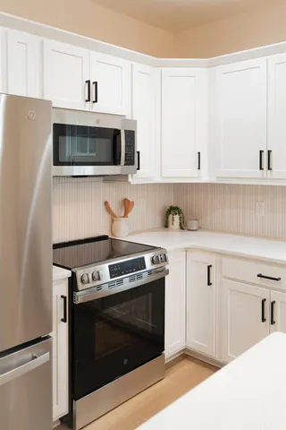 a view of a balcony with wooden floor