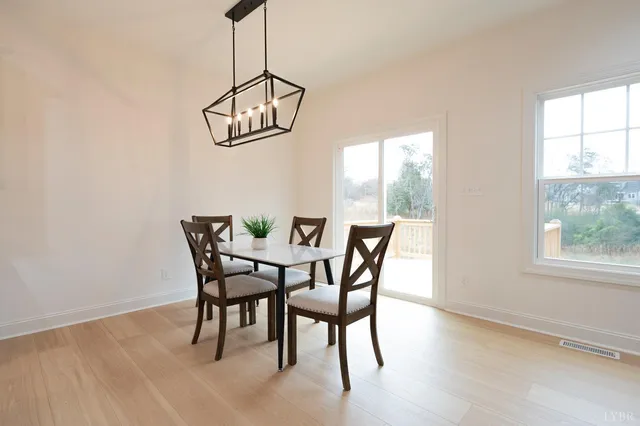 a living room with furniture a rug and a chandelier
