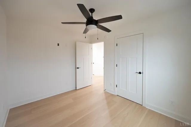 a bathroom with a double vanity sink toilet and shower