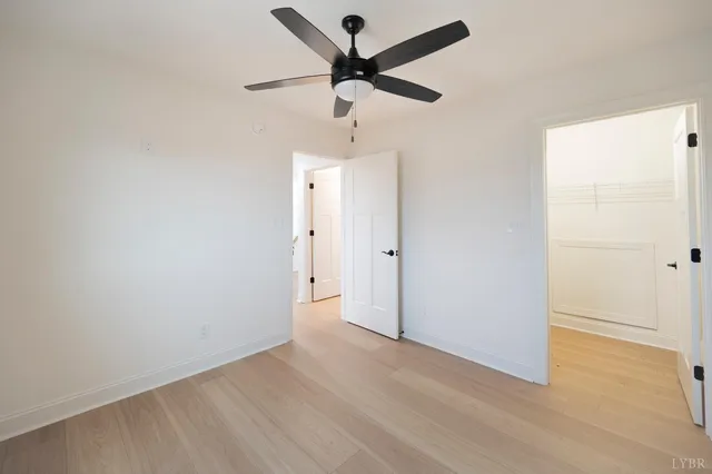 a view of room with wooden walls