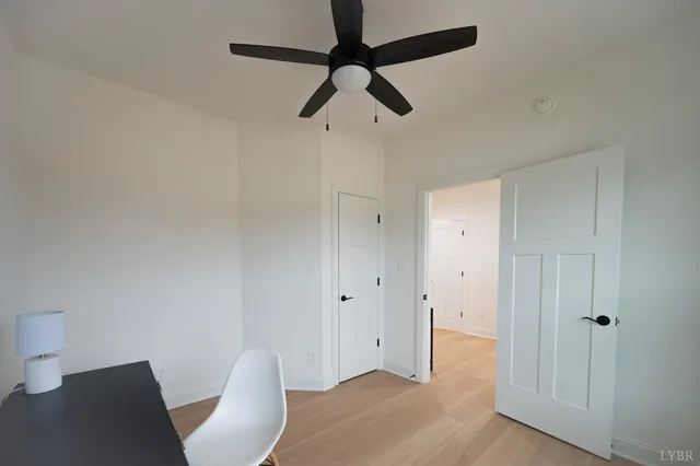 a view of a livingroom with wooden floor