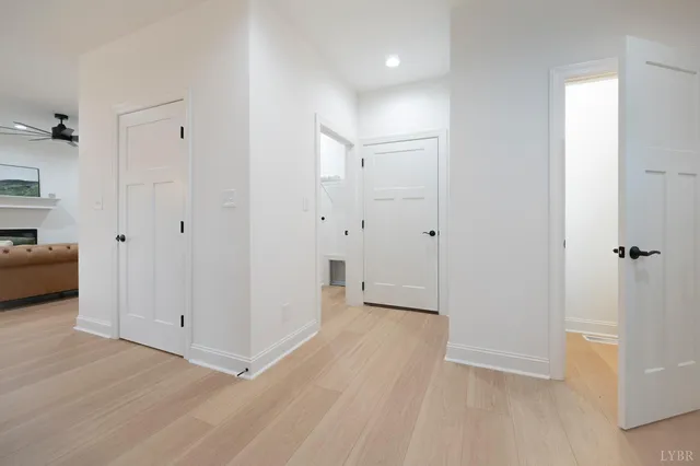 a kitchen with stainless steel appliances kitchen island granite countertop a table chairs sink and cabinets