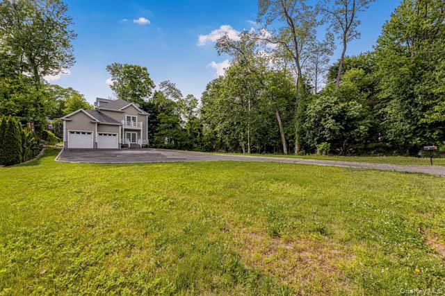 1 Kewanee Road New Rochelle, NY 10804 - Photo 32 of 36 a view of a house with a big yard and large trees