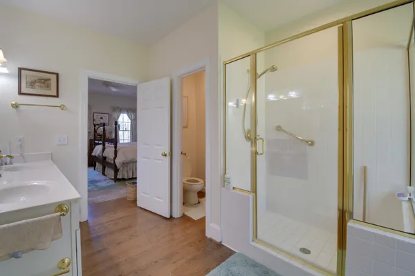 a bathroom with a shower and a sink