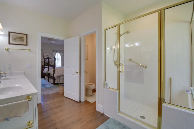 a bathroom with a shower and a sink