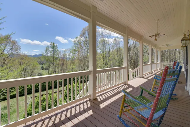 a view of a two chairs in the balcony
