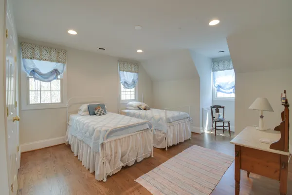a view of a room with wooden floor