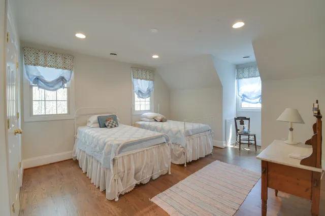 a view of a room with wooden floor