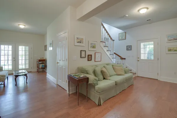 a spacious bathroom with a granite countertop sink a mirror and shower
