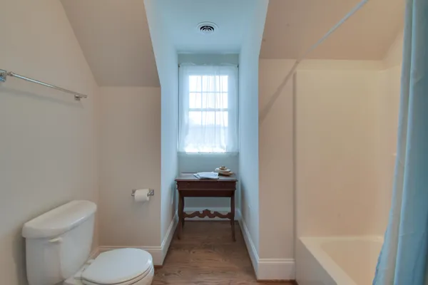 a view of empty room with furniture and fireplace