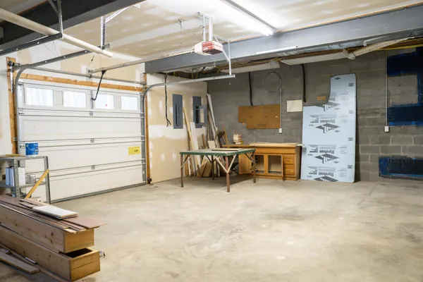 a view of a house with a yard and tree s