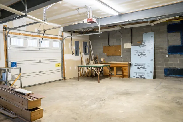 a view of a house with a yard and tree s