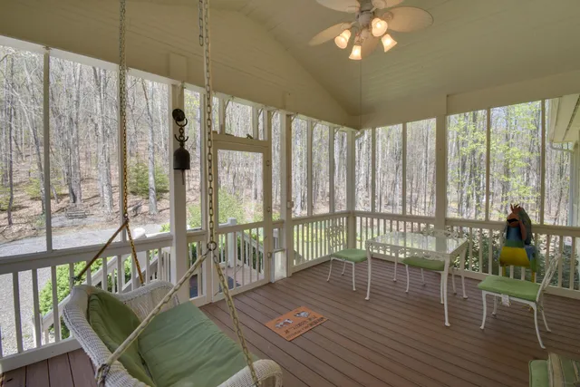 a front view of a house with yard and sitting area