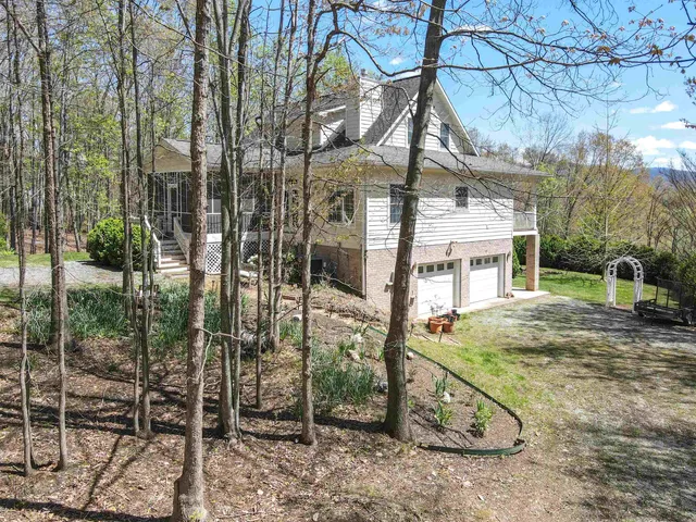 a view of a town with mountains in the background