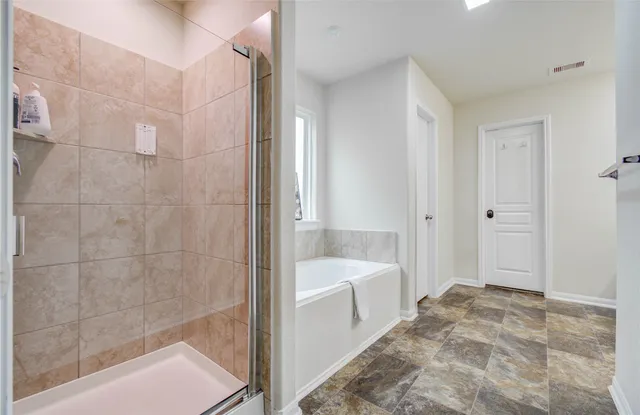 a white toilet sitting next to a bath tub