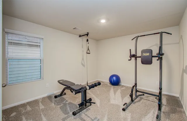 a view of an chairs and table in patio