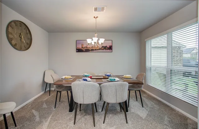 a kitchen with stainless steel appliances granite countertop a refrigerator stove and sink
