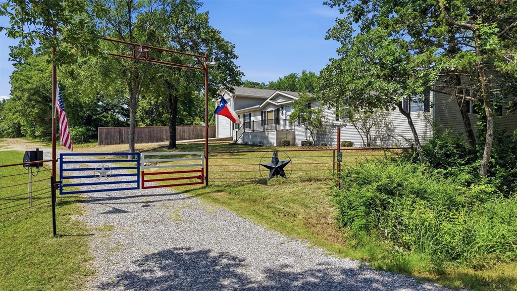 212 Sunset Road Pottsboro, TX 75076 - Photo 3 of 40 a view of a park with large trees