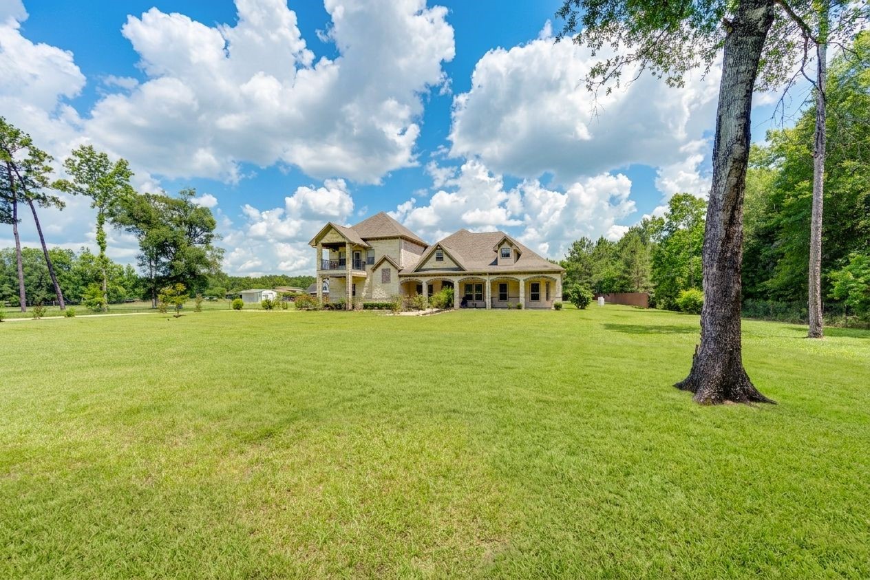 21038 Angus Drive Cleveland, TX 77328 - Photo 3 of 49 a view of a house with a yard