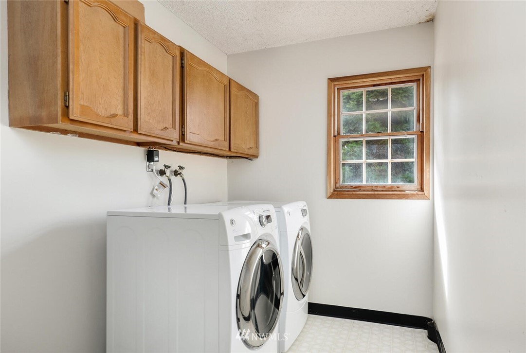 17002 Southeast 128th Street Renton, WA 98059 - Photo 12 of 30 a utility room with dryer and washer