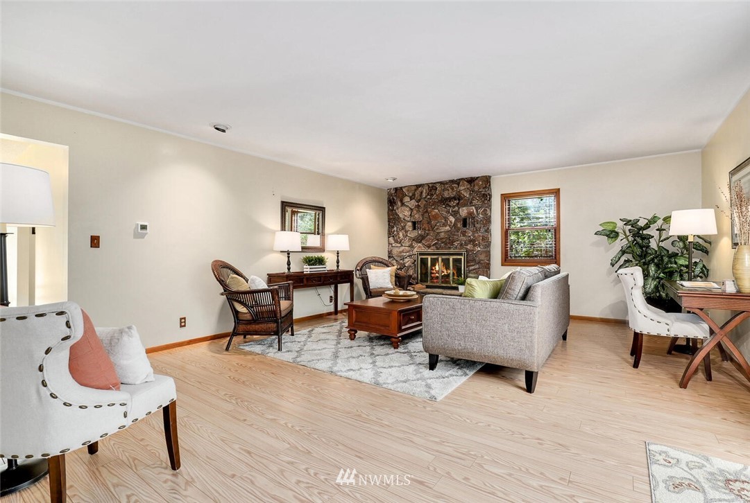 17002 Southeast 128th Street Renton, WA 98059 - Photo 13 of 30 a living room with furniture and wooden floor