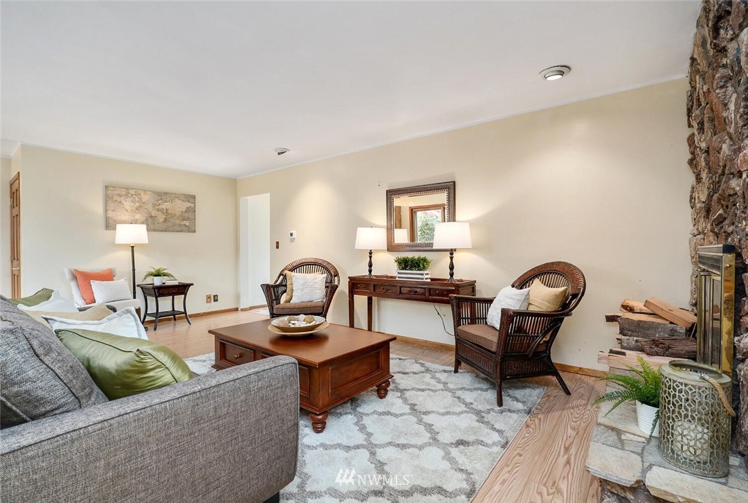 17002 Southeast 128th Street Renton, WA 98059 - Photo 14 of 30 a living room with furniture and a fireplace
