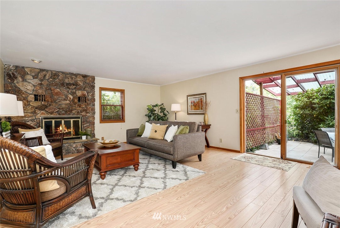 17002 Southeast 128th Street Renton, WA 98059 - Photo 15 of 30 a living room with furniture and a floor to ceiling window