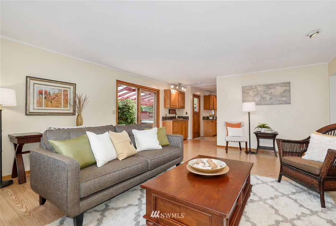 17002 Southeast 128th Street Renton, WA 98059 - Photo 16 of 30 a living room with furniture and wooden floor